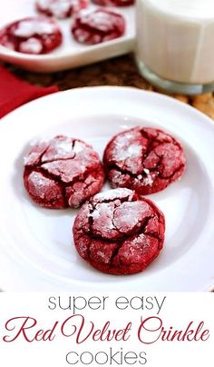 red velvet crinkle cookies on a white plate next to a glass of milk