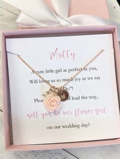 a pink box with a necklace in it that says,'we are our wedding day '