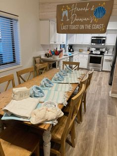 a long table with towels on it in a kitchen