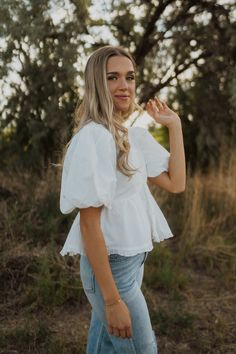 You can never have too many white blouses! Puff sleeve Peplum botton V neckline with a ruffle detail Very flattering fit Model is 5'5" and wearing a size small. Small: 2-4 Medium: 6-8 Large: 10-12 White V-neck Puff Sleeve Top For Brunch, Spring White Blouse With Ruffle Hem, White Ruffle Hem Blouse For Spring, White Spring Blouse With Ruffle Hem, White Blouse With Ruffle Hem For Spring, Feminine Fitted Peplum Top With Puff Sleeves, Feminine White Puff Sleeve Tops, Fitted White Peasant Top With Ruffles, Billowy Puff Sleeve Top For Brunch