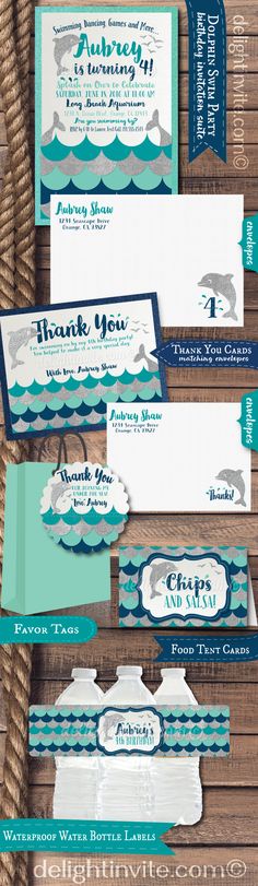 the wedding stationery is set up on top of a wooden table with blue and white paper