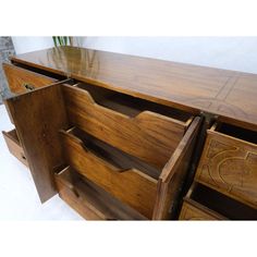 a large wooden dresser with drawers on it