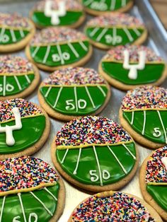 decorated cookies with football field and sprinkles