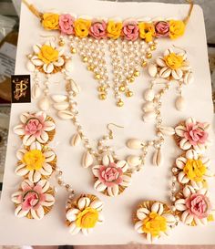 the necklaces are decorated with flowers and pearls