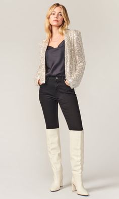 Sparkle and shine in this silver mini sequin jacket that sets the scene for you to steal the spotlight the moment you arrive. Sequin cropped blazer Draped collar Shoulder pads Cropped Lined Length: 20 3/4" Shoulder width: 14 7/8" Self: 100% Polyester; Lining: 100% Polyester Style #: G110J1524 Glamorous Sequin Outerwear For Party Season, Glamorous Contrast Sequin Outerwear For Party Season, Glitter Outerwear For Party Season Night Out, Glitter Outerwear For Night Out And Party Season, Glitter Outerwear For Party Season And Night Out, Spring Outerwear With Glitter For Night Out, Fitted Outerwear With Contrast Sequin For Party Season, Glitter Fitted Outerwear For Party Season, Spring Outerwear With Sequins For Night Out