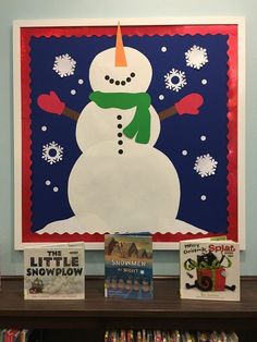 the snowman is on display in front of some children's books