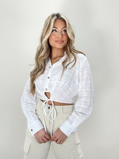 Keep it fun and simple with Lane 201's All Over The Grid Top! This top is so fun and chic that creates the perfect, flattering business casual look! This top features button closures and a tie around the waist to cinch the top around the waist. Pair this top with some business causal trousers or with some denim to wear to a work brunch! 100% Cotton Hand wash cold water, do not bleach, line dry, iron low, do not dry clean. Casual Tied Top For Spring, Spring Button-up Top With Tie Sleeves, Spring Tie Sleeve Button-up Top, Casual Tops With Tie Sleeves For Day Out, Chic Spring Tops With Tied Details, Chic Tied Tops For Day Out, Trendy Long Sleeve Tops With Tie Waist, Trendy Spring Top With Tied Details, Chic Button-up Top With Tie Sleeves