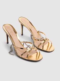 "Find GUCCI 85mm Leather Sandals W/ Crystal Chain on Editorialist. \"85mm Heel. Metallic golden leather upper . \"\"Gucci\"\" pendant. Crystal chain detail . Leather sole" Gold Sandals With Chain Strap For Evening, Luxury Gucci Evening Sandals, Luxury Gold Sandals With Chain Strap, Gucci Luxury Heels For Gala, Luxury Gucci Heels For Gala, Designer Gold Heels With Chain Strap, Luxury Sandals With Chain Strap For Party, Luxury Chain Strap Sandals For Party, Elegant Gucci Sandals For Evening