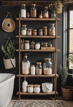 a shelf filled with jars and spices next to a bathtub