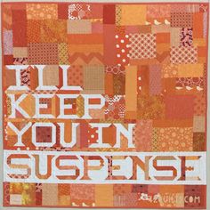 an orange and white quilt with words that says, i keep you in suspense on it