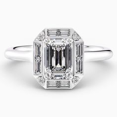 an emerald cut diamond engagement ring with baguets