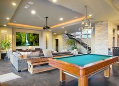 a pool table in the middle of a living room