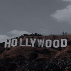 the hollywood sign is on top of a hill