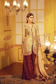 Pure Brocade shirt with resham and zardozi work, paired with Pure Banarsi Chiffon Farshi pants with handwork details all over Shirt Fabric: Pure Brocade Shirt Color: Beige GoldShirt Length : 36" Pant Fabric: Pure Banarsi Chiffon Farshi pants Pant Color: Deep Purple Dupatta: Pure Chiffon with sequins all over Dupatta Color: Beige Gold All outfits are fully lined Lining in sleeves and all see through part is complimentary just mention in custom text box if needed Please refer Size Chart Before sel Brocade Shirt, Casual Bridal Dress, Pakistani Formal Dresses, Zardozi Work, Designer Outfit, Pakistani Fashion Party Wear, Over Shirt, Pure Chiffon, Fancy Dress Design