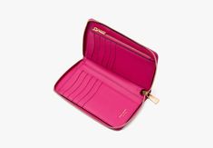 Elegant streamlined and in a just-right size our Katy zip-around wallet is done in textured leather with its signature glossy logo plaque. | Kate Spade Katy Medium Zip-Around Wallet, Wild Raspberry Cheap Kate Spade Wallets With Card Slots, Affordable Elegant Kate Spade Wallets, Glossier Logo, Festival Shop, Hot Bags, Kate Spade Wallet, Summer Essentials, Continental Wallet, Zip Around Wallet