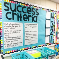 the bulletin board is decorated with colorful polka dots and blue bins for organizing items