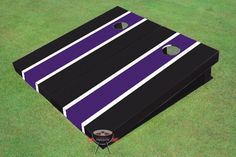 a large black and brown striped cornhole game