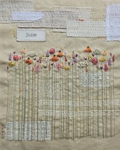 a close up of a piece of cloth with flowers on it and the words june