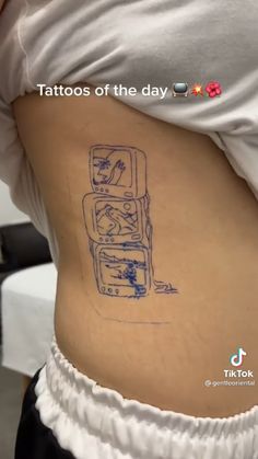 a woman's stomach with a tattoo on it that has an image of a refrigerator