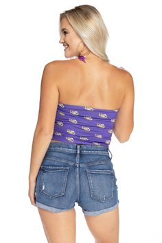 Show off on gameday in the most comfortable LSU Tigers tube top. 100% Polyester. Sublimated design. Made in the USA. Purple Collegiate Tops For Sports Events, Collegiate Purple Top For Sports Events, Collegiate Tops For Sports Events, Collegiate Style Summer Fan Gear Tops, Collegiate Summer Fan Gear Tops, Sports Fan Tops For Game Day In Summer, Collegiate Purple Top For Game Day, Sporty Stretch Tube Top For Sports, Purple Casual Tops For Sports Events