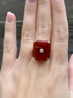 Total Weight: 8.7 grams Size: 7 Band Width: 2-6mm Carnelian: 20x17mm Diamond: approximately 3mm Condition: In great vintage condition. Lightly polished showing little wear. Carnelian and diamond both in great shape. Sizing insert isn't making it much smaller and can be remove upon request.  All gold has been thoroughly checked with an Olympus XRF spectrometer. It is guaranteed 14k gold.  All our jewelry is properly washed and disinfected to ensure customers get clean items with every order.  Ret Classic Carnelian Rings With Polished Finish, Luxury Carnelian Jewelry For Formal Occasions, Luxury Carnelian Ring For Formal Occasions, Classic Yellow Gold Carnelian Jewelry, Classic Carnelian Yellow Gold Jewelry, Classic Carnelian Cabochon Rings, Heirloom Carnelian Yellow Gold Rings, Formal Red Carnelian Jewelry, Elegant Carnelian Ring For Formal Occasions