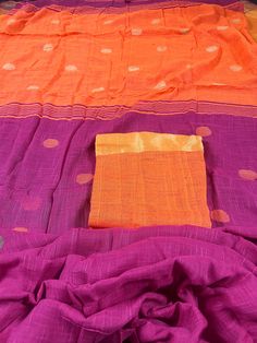 Beautiful Handloom Saree Pure Khaadi Cotton blend with Linen. Saree is handwoven with Zari Borders. Gicha Threads used for Buttas all over the saree. Item : SareeColor : Pink and Bright Orange Base Fabric : Pure Khaadi Cotton blend with LinenBlouse piece : Comes with un-stitched Blouse piece.Blouse material :Pure Khaadi Cotton blend with LinenWork : Handloom SareeFall & Edging done (Yes/No) : YesDisclaimer -:- Color variation is possible due to various reasons like phone or desktop setting, reso Orange Cotton Saree With Pallu Detail, Orange Cotton Saree For Puja, Summer Cotton Saree With Pallu Detail, Cotton Saree With Pallu For Summer, Summer Handloom Cotton Saree, Handloom Cotton Saree In Orange, Orange Cotton Handloom Saree, Purple Cotton Saree With Zari Work, Multicolor Handloom Dupatta For Summer