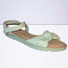 New. Never Worn. Add A Delightful Twist To Her Style With These Mint Green Faux Leather Sandals Featuring Charming Knot Straps And Easy-On Off Velcro And Loop Closures For A Touch Of Sweetness In Every Step. Material: Faux Leather- Polyurethane Instructions: Spot Clean Cute Green Open Toe Sandals, Spring Flat Heel Sandals With Soft Sole, Green Adjustable Sandals With Round Toe, Adjustable Green Sandals With Round Toe, Spring Sandals With Soft Sole In Synthetic Material, Comfortable Sandals With Soft Sole For Spring, Spring Sandals With Soft Synthetic Sole, Cute Adjustable Synthetic Sandals, Adjustable Green Round Toe Sandals