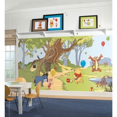 winnie the pooh wall mural in a child's room