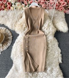 Beige Knit V-neck Midi Dress, Fitted V-neck Sweater Dress, Sleeveless Stretch Sweater Dress For Party, Chic Sleeveless Knit Bodycon Dress, Casual Beige V-neck Bodycon Dress, Stretch Sleeveless Sweater Dress For Party, Elegant Knit Sleeveless Dress For Spring, Elegant Sleeveless Knit Bodycon Dress, Beige Stretch V-neck Sweater Dress