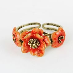 Gorgeous vintage articulated bracelet with enameled flower.       Condition:  Very good preowned condition.  Creator: -  Materials and Techniques:  metal, enamel  Marks:    Date (~):  1960s  Place of Origin:  France  Measurements: Diameter interior 5,5 cm, middle flower 3,5 cm  Weight: circa 70 gr Adjustable Vintage Flower Shaped Jewelry, Gold Flower-shaped Enamel Ring, Gold Enamel Flower Ring, Unique Metal Flower Jewelry, Unique Flower Shaped Metal Jewelry, Unique Flower-shaped Metal Jewelry, Unique Enamel Flower Shaped Jewelry, Unique Enamel Flower Jewelry, Vintage Orange Flower Jewelry