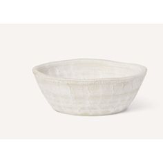 a white bowl sitting on top of a table