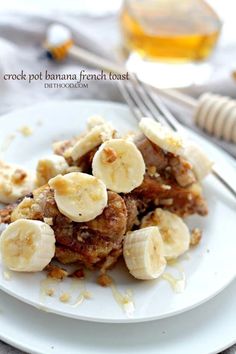 a white plate topped with banana french toast