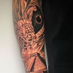 a man with a tattoo on his arm