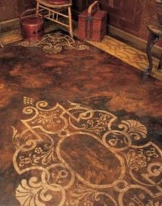 an ornately designed rug in the corner of a room