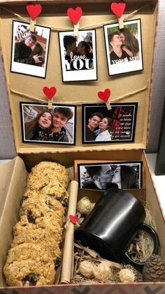 an open box filled with cookies and pictures