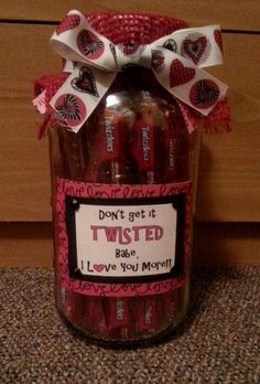 a jar filled with lots of candy and some ribbon around it's top that says, don't get it twisted race i love you more