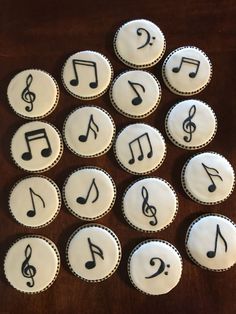 twelve cupcakes with musical notes on them