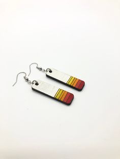 Check out these great Wooden Geometric Hand Painted Dangle Earrings! These minimalist Art Deco earrings are a fun way to bring bring colors to your wardrobe! Each wooden earring is laser cut from recycled wood drops and then handpainted by me! Due to the fact that wood is a natural product, the grain may affect color absorption making them even more unique from one piece to the next! The edges of the wood are a dark brown from the laser cutting process and accentuate the color of the earrings pe Moving Jewelry, Minimalist Art Deco, Deco Earrings, Geometric Star, Art Deco Earrings, Sustainable Jewelry, Wooden Earrings, Recycled Wood, Wood Earrings