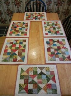 the table is made up with four different quilts