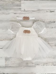 This listing is for a soft white tutu dress, and your option of matching headband!  Perfect for that 1st birthday!!  ~headband elastic can be made in any color! ~ ships within 1 to 3 business days (message me with any additional questions)! ~ headband backed with felt for comfort {{SIZING}}  6-9 months (fits 18-20 lbs.) 9-12 months (fits 20-22 lbs.) 12-18  months  (fits 22-26 lbs.) 18-24 months  (fits 26-30 lbs.)  Don't forget to like my Facebook page for 10% off coupon https://www.facebook.com/ White Tutu Dress For First Birthday In Summer, White Ruffles Tutu Dress For First Birthday, White Ruffled Tutu Dress For First Birthday, Cream Ruffled Dress For Cake Smash, White Cute Tutu Dress For First Birthday, White Fitted Dress With Matching Headband, White Tulle Tutu Dress For Cake Smash, White Tutu Dress, Boho Cake