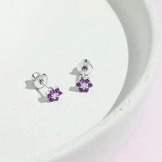 Dazzling multi-color cubic zirconia flower earrings for little girls. This dainty 5mm flower earrings set was crafted entirely in 925 sterling silver, a naturally hypoallergenic precious metal that is suitable for sensitive ears. They feature threaded posts and a safety screw-back system to ensure your child's earrings stay comfortably in place. These earrings make a perfect gift for any occasion as well as for everyday fashion for infants & toddlers or little girls. A complimentary gift box is Tiny Silver Cubic Zirconia Earrings, Silver Cubic Zirconia Birthday Earrings, Silver Cubic Zirconia Earrings For Birthday, Gift White Gold Flower Earrings With Cubic Zirconia, Silver Cubic Zirconia Flower Earrings As Gift, Silver Cubic Zirconia Flower Earrings For Gift, Silver Flower Earrings With Prong Setting As Gift, White Cubic Zirconia Birthstone Earrings, Sterling Silver Flower Earrings With Prong Setting As Gift