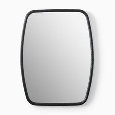 a mirror that is on the wall with a black frame and some lines around it