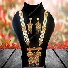 This is a stunning handmade necklace perfect for high end Jewelry Collector, a keeper in Traditional Vintage Indian/Pakistani Bridal jewelry and a Luxury Gift for your Daughter, Sister or Wife on Wedding or Anniversary. Perfect for any type of occasions, weddings And celebrations and a beautiful & memorable gift for weddings and special occasions. -Item Code:- L -Rajwada Necklace Set with Earrings. -Designer multi layered pearl necklace with meenakari Kundan pendant. -Gold Plated Set with Kundan Stones which shine like Polki Diamonds. -Metal: Gold plated brass -Earrings are 78mm long and 27mm wide. -Push Back Earrings and Adjustable necklace with a Dori/Cord -Necklace length with pendant 13" approx excluding dori/cord -Green & Red Meenakari on kundan Set. -Quantity:- One Necklace Set Pleas Traditional Multicolor Peacock Design Jewelry, Meenakari Jewelry Pendant As A Gift, Intricate Design Pearl Necklace As Festival Gift, Festive Pearl Necklace With Intricate Design As Gift, Bollywood Style Multicolor Peacock Design Necklace, Bollywood Style Multicolor Peacock Necklace, Festival Gift Pearl Necklace With Intricate Design, Temple Jewelry With Meenakari As Gift, Heavy Necklace For Diwali Gift