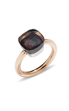 a gold ring with a black stone in the center