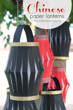 three black and red lanterns hanging from chains with the words chinese paper lanterns above them