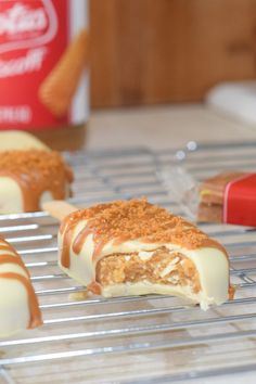 some desserts are sitting on a rack with the words biscoff cake slices