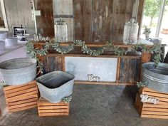 three buckets are sitting next to each other in front of a sign that says love