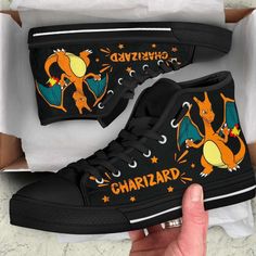 Introducing our Charizard High Top Shoes Custom For Fans Pokemon, the ultimate footwear for Pokemon enthusiasts! Step into the world of adventure and style with these captivating shoes that are designed to turn heads wherever you go. Our Charizard High Top Shoes are custom-made with meticulous attention to detail, featuring the iconic fiery Charizard design that every Pokemon fan will instantly recognize. The vibrant colors and intricate artwork bring this legendary creature to life, creating a Sneakers High Top, Sport Shoes Men, Black High Tops, Mens High Tops, 3d Printable, Shoe Gifts, Boots And Sneakers, High Top Shoes, Dinosaur Print