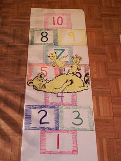 a child's bookmark with numbers and giraffes on it