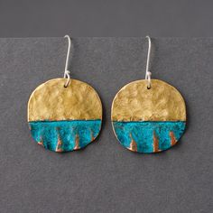 These classy minimalistic drop earrings are perfect for daily wear as well as evening outfit. Reminding of beach sands and waves these homemade earrings will be a modern artisan jewelry gift for any sea lover.  They are made of hammered brass and copper with natural blue patina. Ear wires are made of sterling silver. These shapes are free formed and may vary subtly. Available in two diameters, please see the sizes comparison on the last photo.  Sizes: bigger earrings: 1.1"x1.8" total length with Everyday Minimalist Handmade Earrings, Minimalist Beach Jewelry With Ear Wire, Minimalist Earrings For Summer, Minimalist Sterling Silver Earrings For Summer, Everyday Summer Brass Earrings, Blue Artsy Jewelry For Beach, Handmade Brass Earrings For Summer, Minimalist Metal Earrings For Summer, Summer Brass Earrings Perfect For Gifts